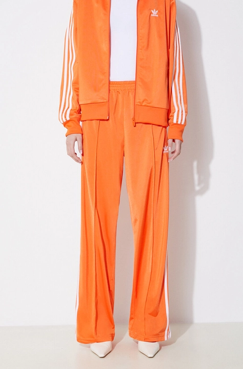 Tepláky adidas Originals oranžová farba, s nášivkou, IP0640