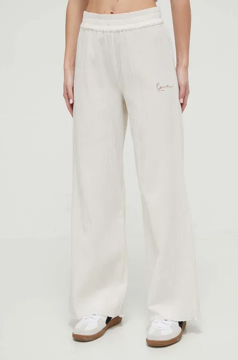 Bavlněné kalhoty Karl Kani béžová barva, široké, high waist