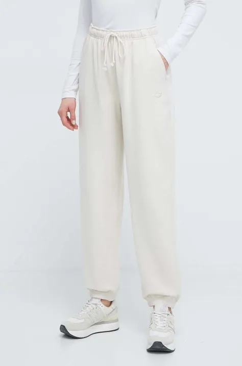 New Balance spodnie dresowe bawełniane WP41513LIN kolor beżowy gładkie