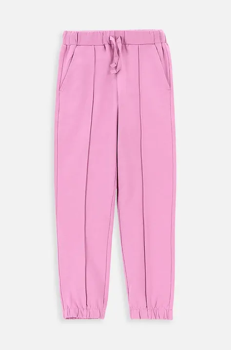 Coccodrillo spodnie dresowe dziecięce kolor różowy z nadrukiem