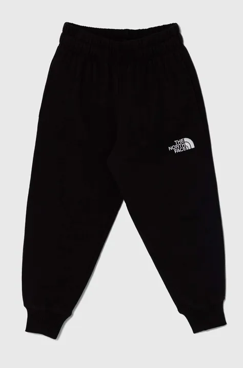 Otroška bombažna trenirka The North Face OVERSIZED JOGGERS črna barva