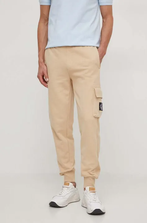 Бавовняні спортивні штани Calvin Klein Jeans колір бежевий однотонні