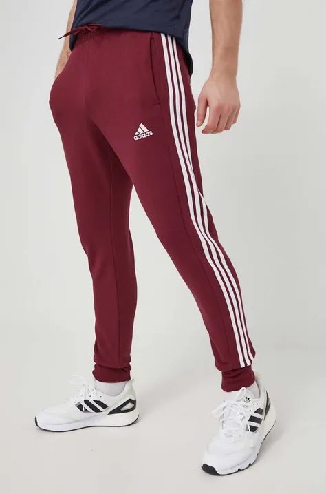 Хлопковые спортивные штаны adidas цвет бордовый с аппликацией
