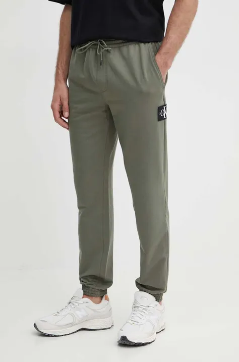 Tepláky Calvin Klein Jeans zelená farba, s nášivkou, J30J325336