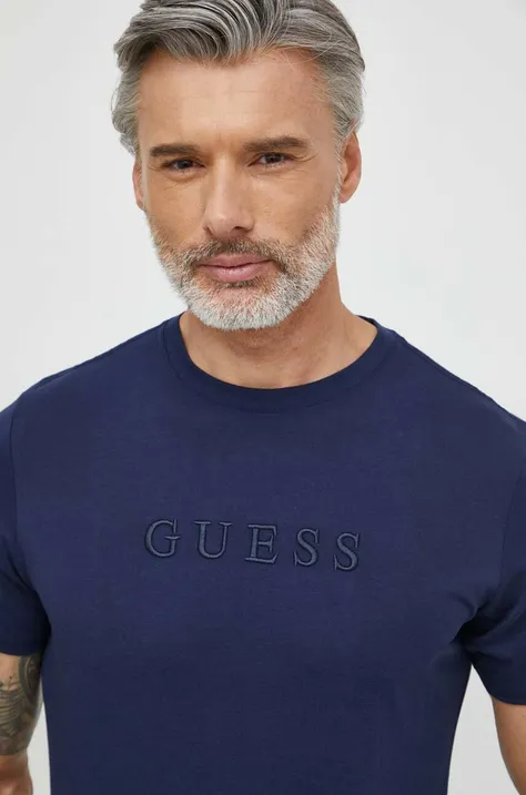 Pamučna majica Guess za muškarce, boja: tamno plava, s aplikacijom