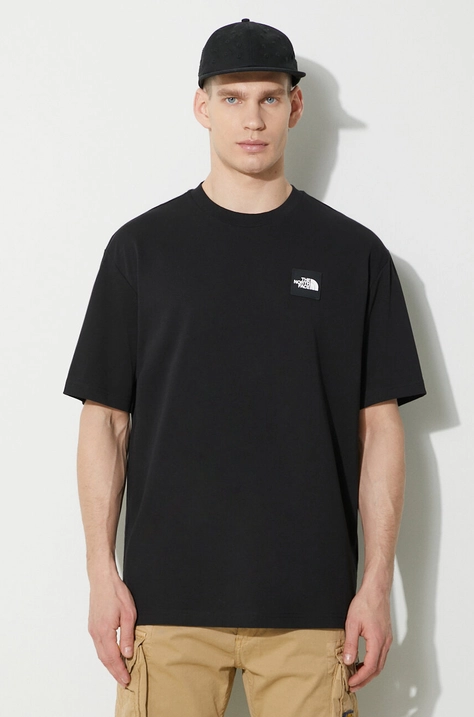 Памучна тениска The North Face M Nse Patch S/S Tee в черно с апликация NF0A87DAJK31