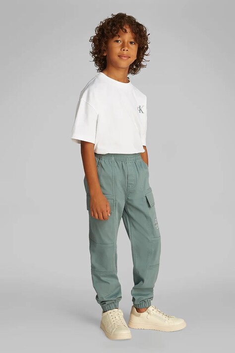 Calvin Klein Jeans pantaloni copii ESSENTIAL WOVEN CARGO culoarea turcoaz, uni, IB0IB02270