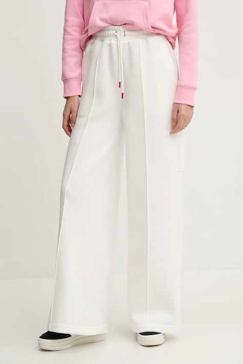 Tepláky Tommy Jeans béžová farba, jednofarebné, DW0DW20560