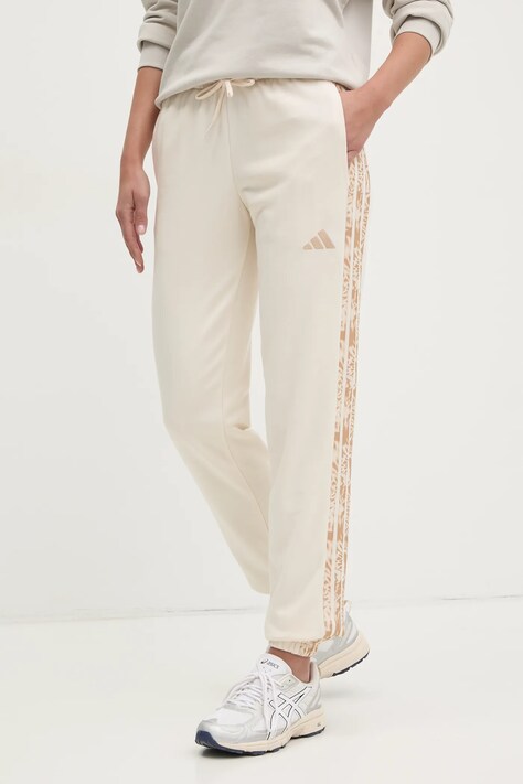 Спортивные штаны adidas Essentials Animal женские цвет бежевый с узором JM1667