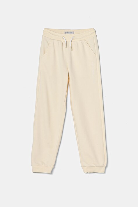 Dětské tepláky Tommy Hilfiger béžová barva, hladké, KG0KG08325