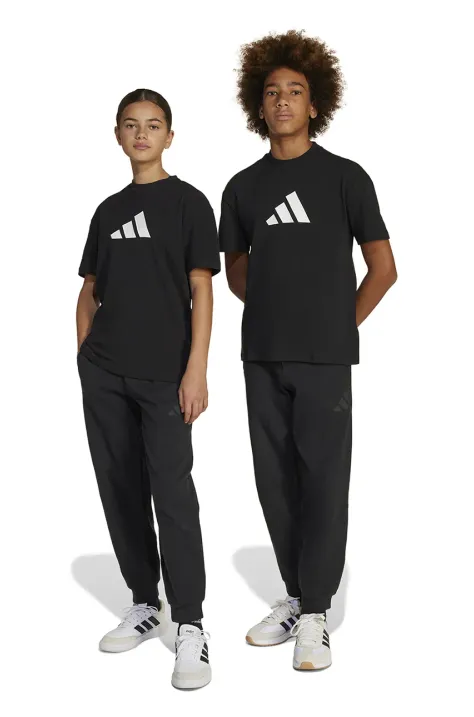 Otroški spodnji del trenirke adidas črna barva, JC7566