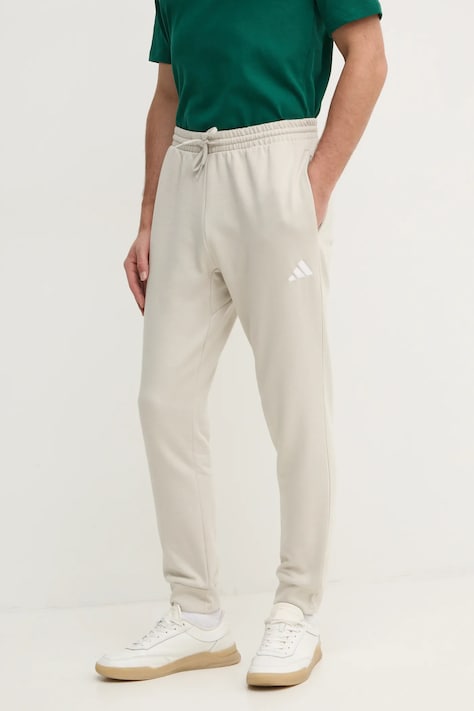 Спортивні штани adidas Feelcozy колір бежевий однотонні IN6078