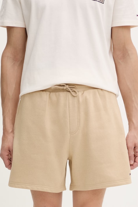 Tommy Jeans teplákové šortky pánské s bavlnou béžové regular waist DM0DM21931