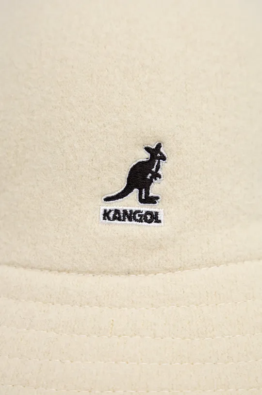 Вълнена капела Kangol  Основен материал: 67% Вълна, 33% Модакрил Други материали: 100% Найлон