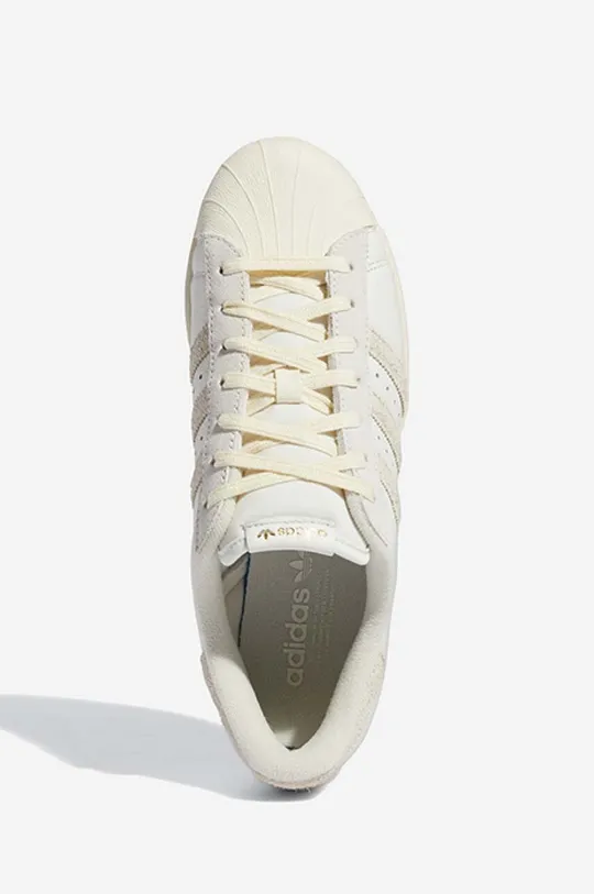 creamy adidas Originals leather sneakers