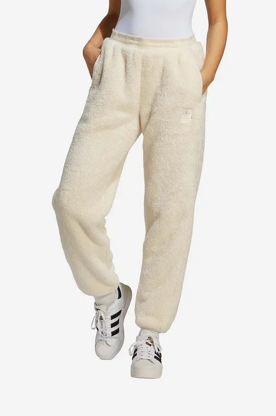 beżowy adidas spodnie dresowe ESS+ Pants IC2256 Damski