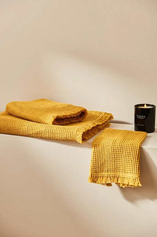 Μεσαία βαμβακερή πετσέτα Calma House Marte 50x100 cm κίτρινο