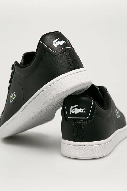 Lacoste leather shoes  Uppers: Natural leather Inside: Textile material Outsole: Synthetic material