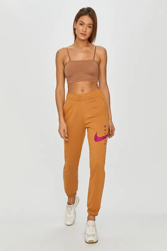 Nike Sportswear - Spodnie pomarańczowy