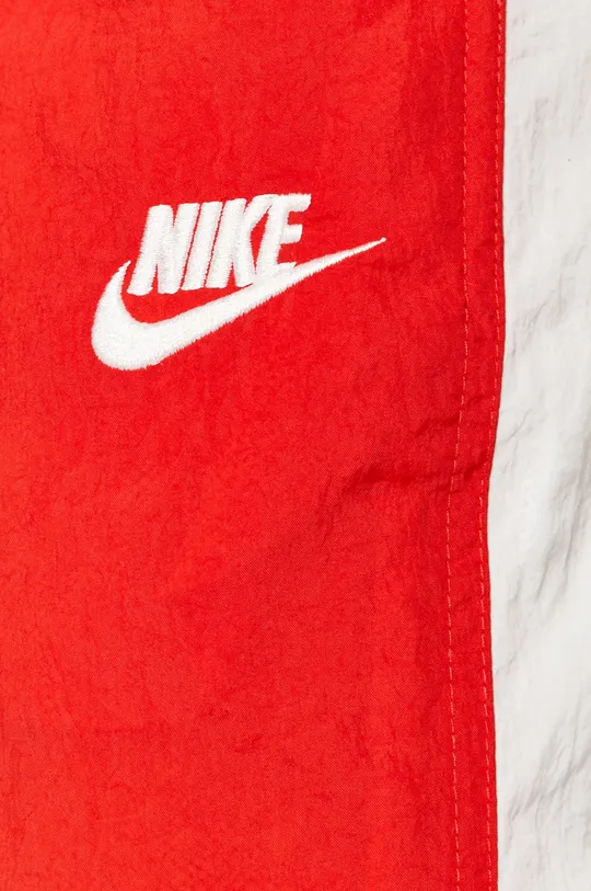 червоний Nike Sportswear - Штани