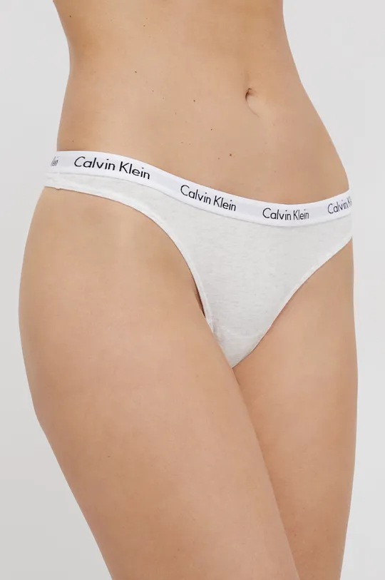 Tangá Calvin Klein Underwear  1. látka: 90% Bavlna, 10% Elastan 2. látka: 9% Elastan, 64% Nylón, 27% Polyester