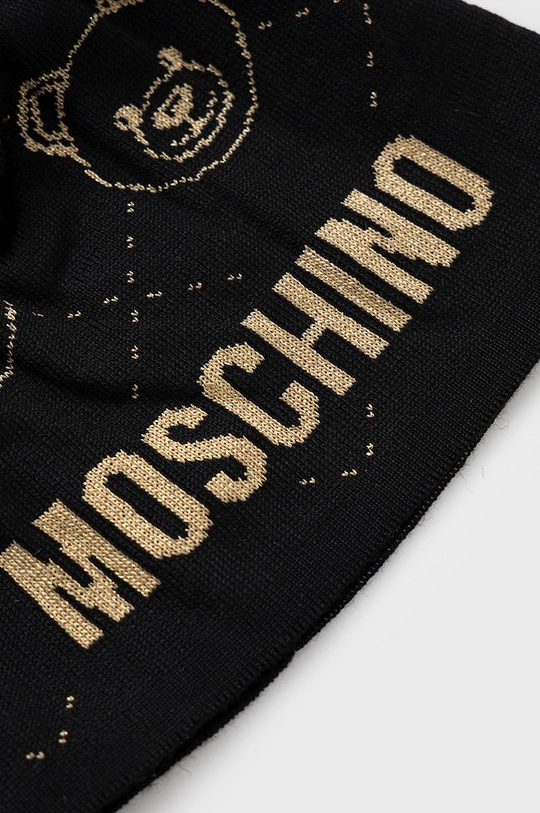 Σκούφος Moschino  44% Oξικό άλας, 25% Ακρυλικό, 3% Πολυαμίδη, 3% Πολυεστέρας, 25% Μαλλί