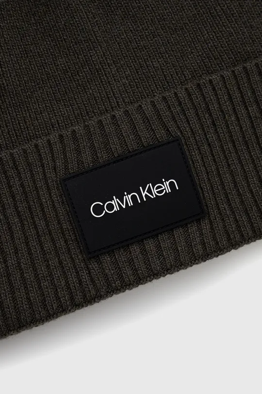 Kapa s dodatkom vune Calvin Klein  5% Kašmir, 35% Poliamid, 30% Vuna, 30% Viskoza