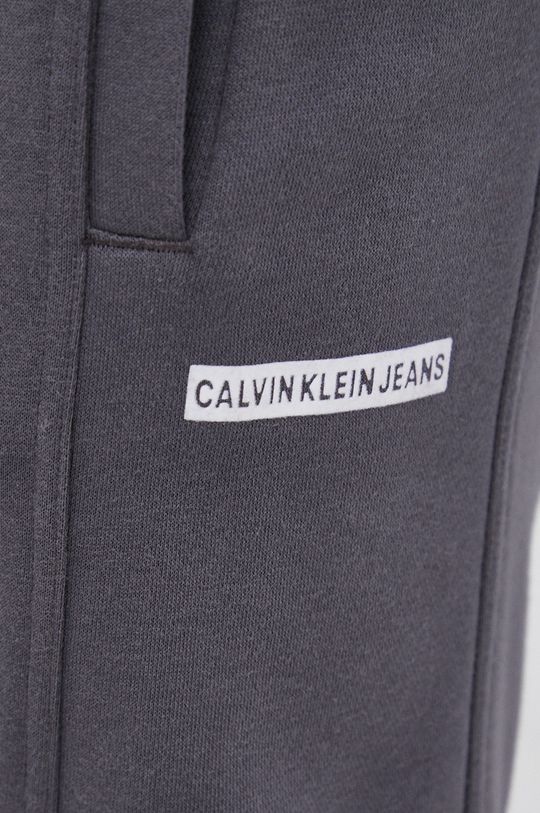 šedá Kalhoty Calvin Klein Jeans