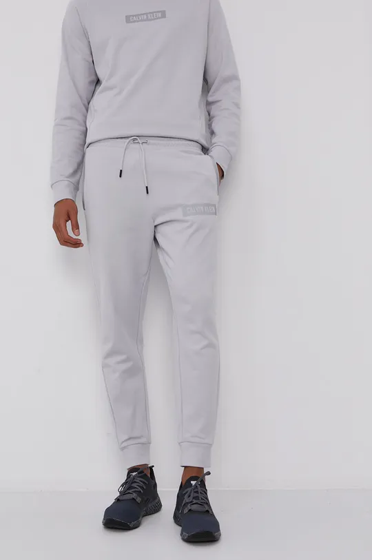 Nohavice Calvin Klein Performance sivá