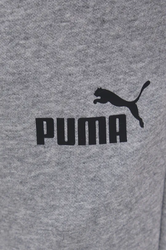 Nohavice Puma 586748  Základná látka: 66% Bavlna, 34% Polyester Podšívka vrecka: 100% Bavlna Elastická manžeta: 97% Bavlna, 3% Elastan