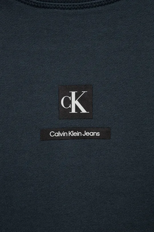 Otroška bombažna mikica Calvin Klein Jeans  Glavni material: 100% Bombaž Patent: 98% Bombaž, 2% Elastan