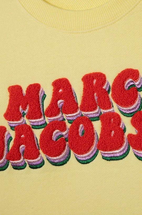 Dječja pamučna dukserica Marc Jacobs  Temeljni materijal: 100% Pamuk Drugi materijali: 97% Pamuk, 3% Elastan Aplikacija: 68% Pamuk, 29% Poliester, 2% Elastan, 1% Metalično vlakno