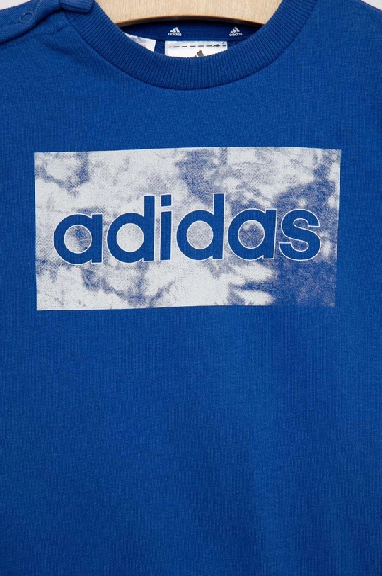 Dječji komplet adidas  Temeljni materijal: 70% Pamuk, 30% Poliester Manžeta: 95% Pamuk, 5% Elastan