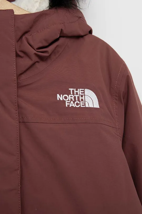 The North Face kurtka puchowa dziecięca  Materiał zasadniczy: 100 % Nylon Podszewka: 100 % Poliester Wypełnienie: 90 % Puch z recyklingu, 10 % Pierze z recyklingu Sztuczne futerko: 70 % Akryl, 17 % Poliester, 13 % Modakryl