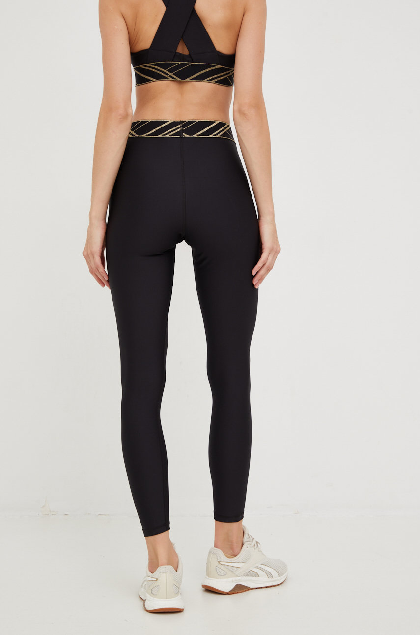 Puma leggins de antrenament Deco Glam  Materialul de baza: 77% Poliester , 23% Elastan Banda elastica: 51% Nailon, 49% Poliester