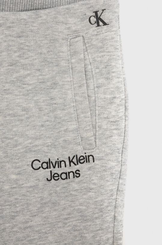 Dětské tepláky Calvin Klein Jeans  85% Bavlna, 15% Polyester