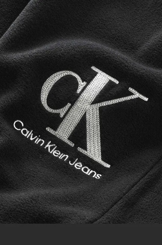 Dječji donji dio trenirke Calvin Klein Jeans  Temeljni materijal: 100% Poliester Završni sloj: 100% Poliester