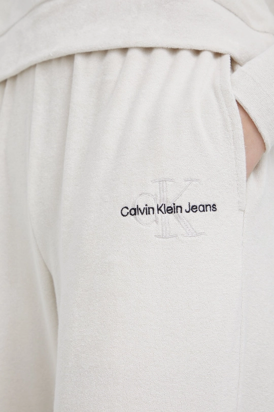 бежевий Спортивні штани Calvin Klein Jeans