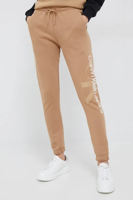 beżowy Calvin Klein Jeans spodnie dresowe Damski