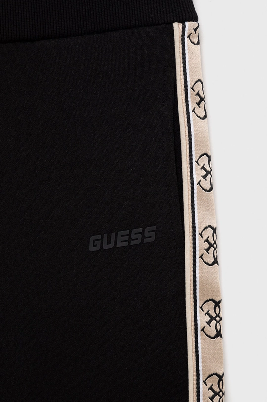 Детские спортивные штаны Guess  Основной материал: 75% Хлопок, 25% Полиэстер