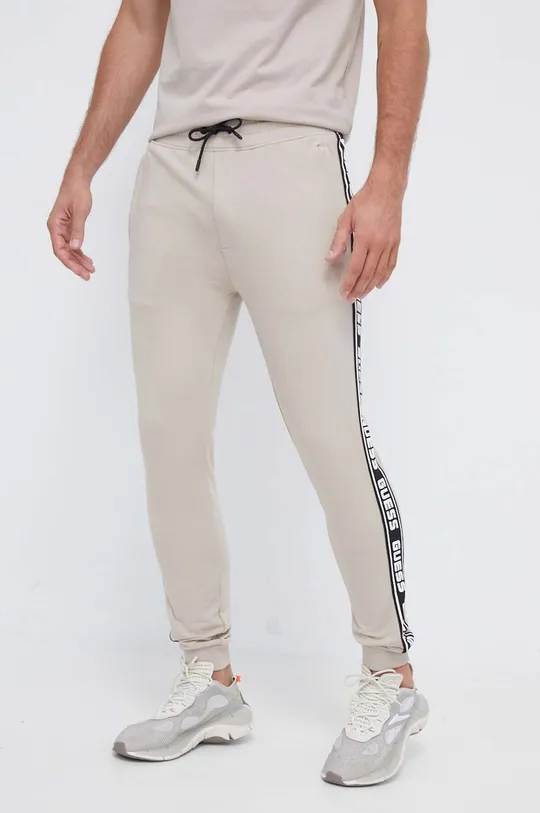 beige Guess joggers Uomo