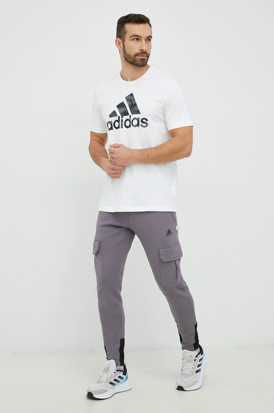 Tepláky adidas Performance fialová