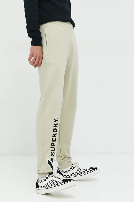 beżowy Superdry spodnie dresowe bawełniane Męski