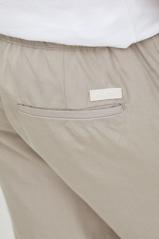 beżowy Calvin Klein spodnie dresowe z domieszką lnu