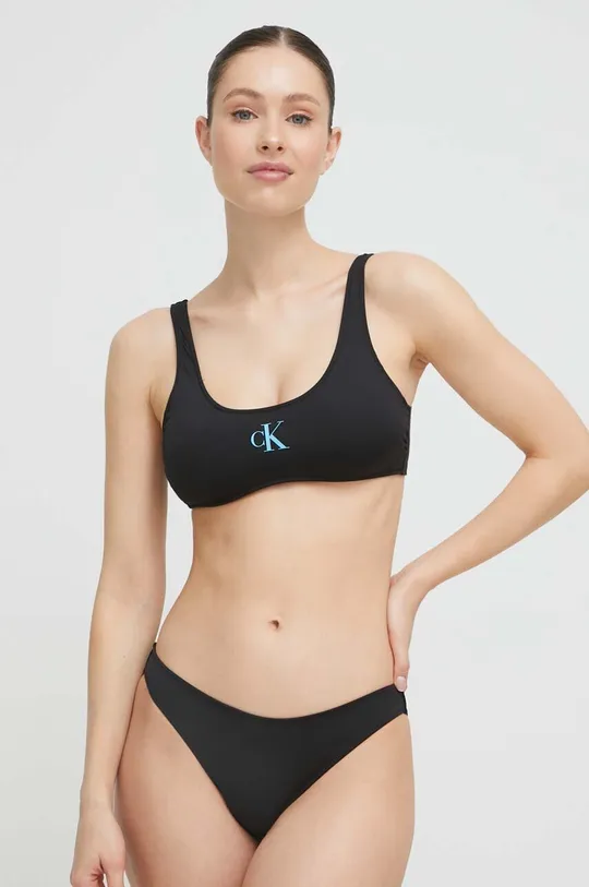 Calvin Klein bikini felső  Jelentős anyag: 85% poliészter, 15% elasztán Bélés: 90% poliészter, 10% elasztán