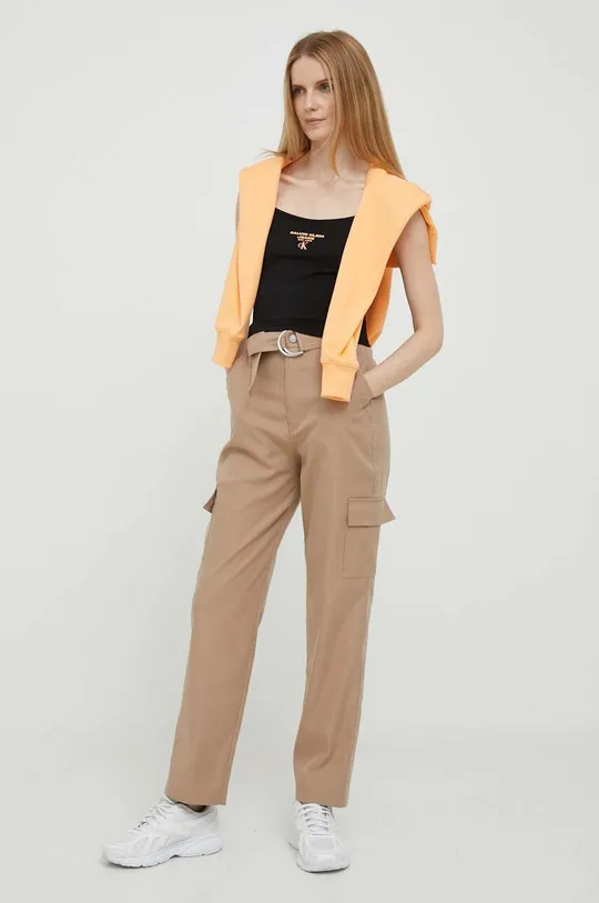 Bombažen pulover Calvin Klein Jeans oranžna