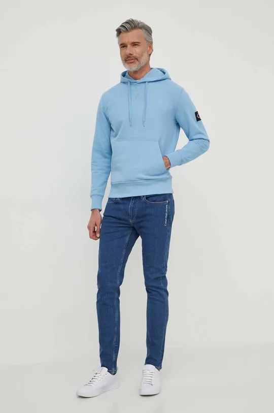 Bombažen pulover Calvin Klein Jeans modra