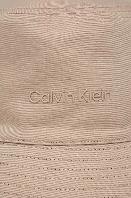 bež Dvostranski bombažen klobuk Calvin Klein