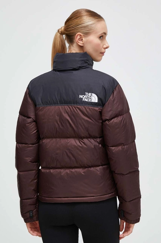 The North Face pehelydzseki Jelentős anyag: 100% nejlon Bélés: 100% nejlon Kitöltés: 90% pehely, 10% toll