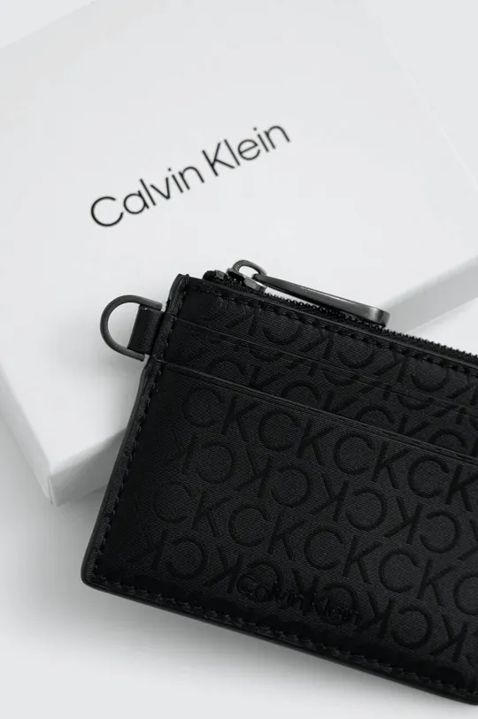 Πορτοφόλι Calvin Klein  Κύριο υλικό: 51% Πολυεστέρας, 49% Poliuretan Φινίρισμα: Δέρμα βοοειδών